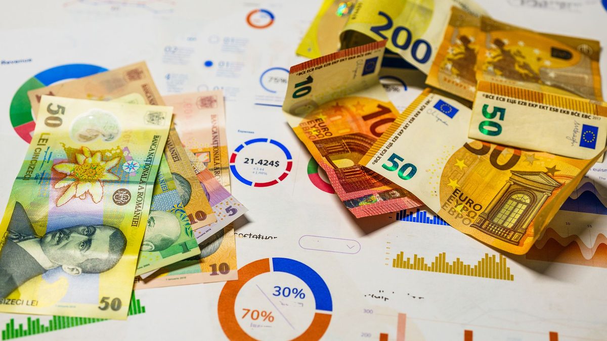Colorful Euro and Romanian Lei banknotes on top of financial charts, symbolizing currency exchange and economic analysis.